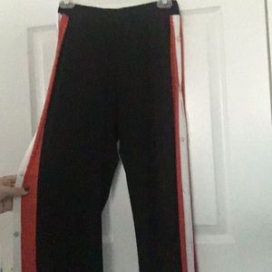Black open button pants with red and white stripes